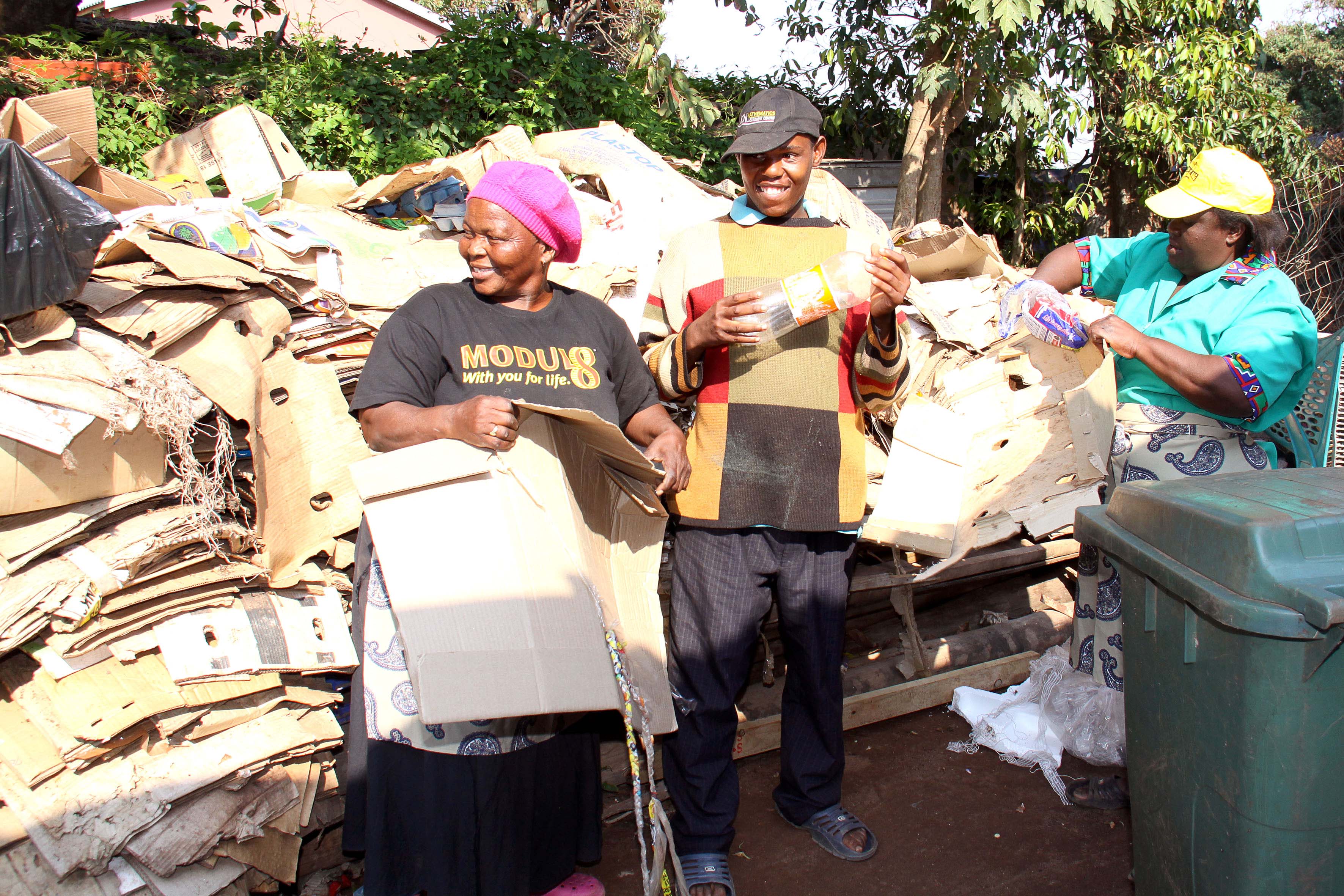 black women and man recycling