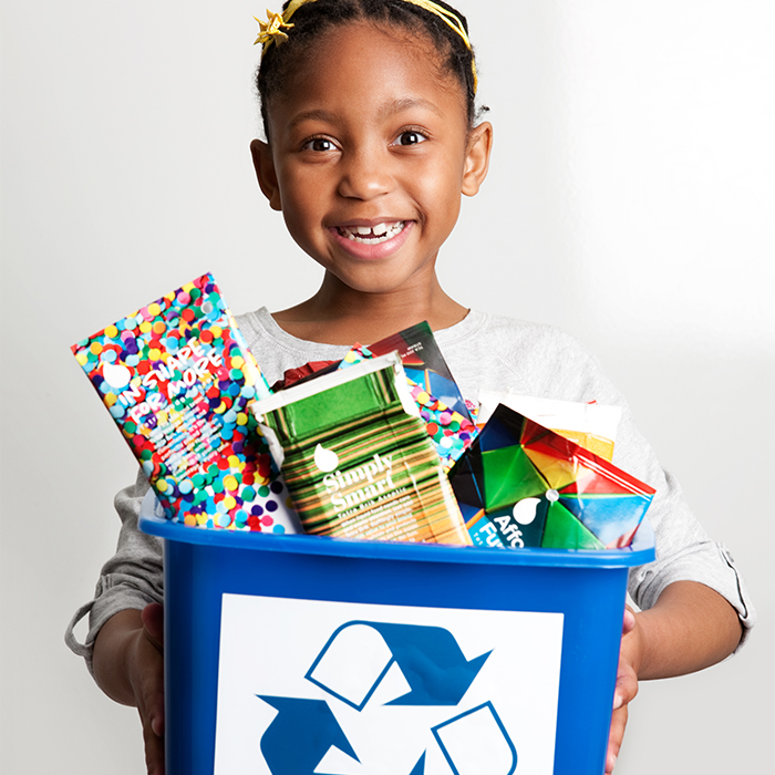Little-girl-recycling-cartons---Credit-Tetra-Pak Little-girl-recycling-cartons---Credit-Tetra-Pak