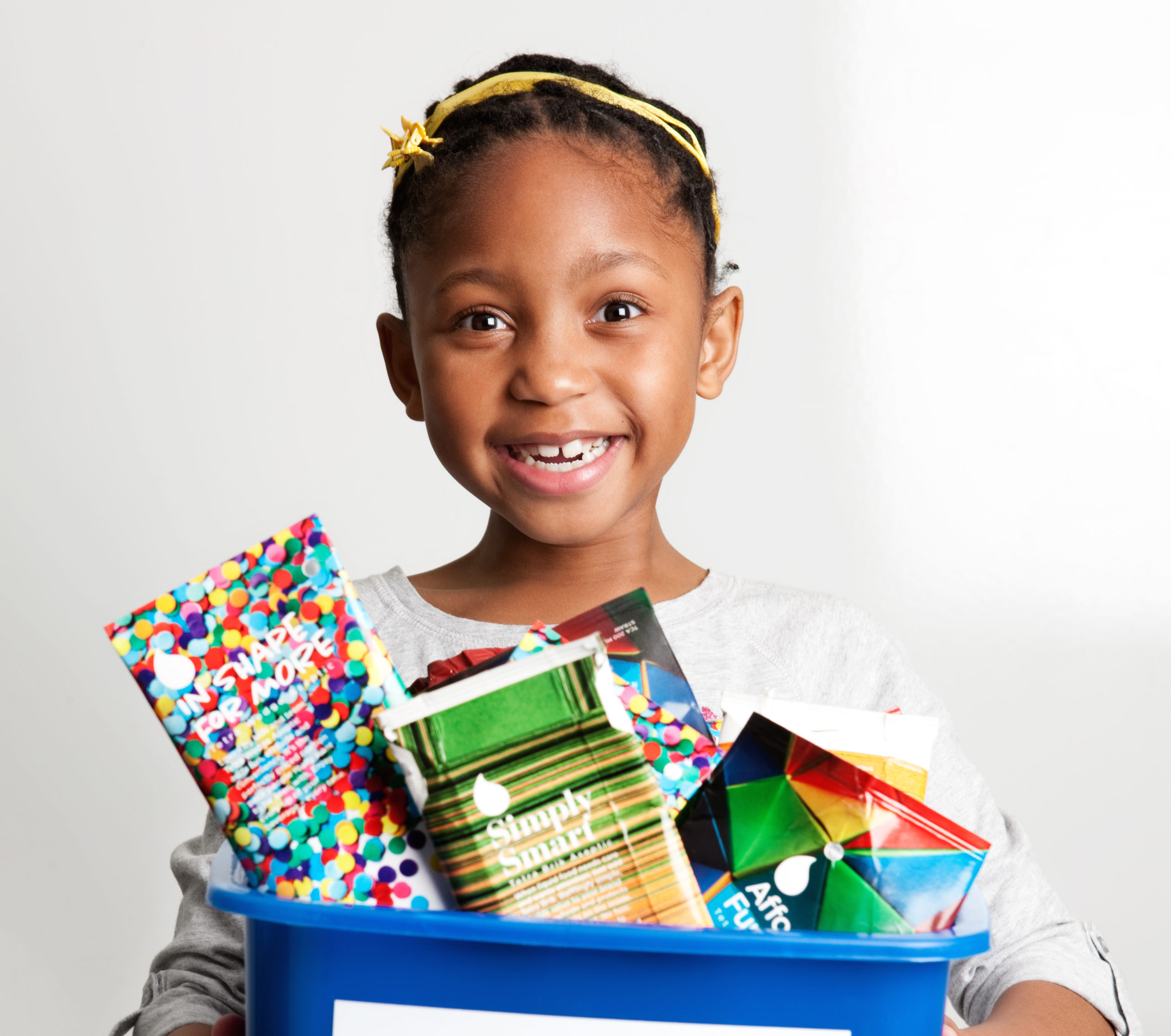 Little-girl-recycling-cartons-Credit-Tetra-Pak-cropped-1